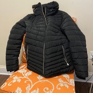 Women’s black puffer coat. With hideaway hood.